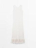 Knit dress with fringed hem