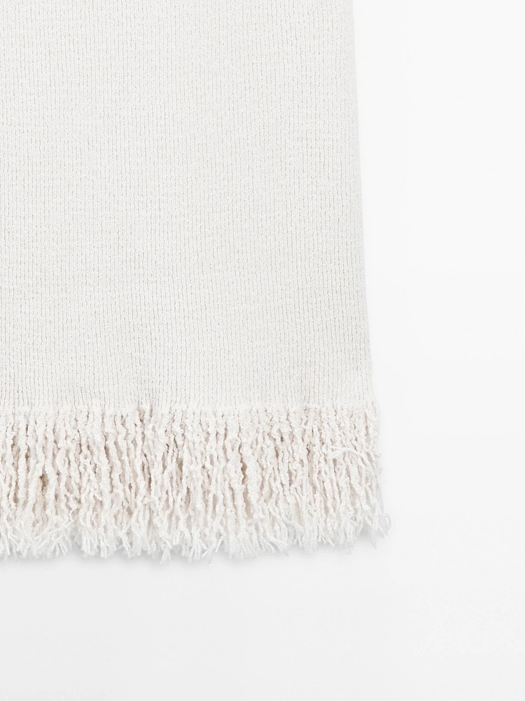 Knit dress with fringed hem