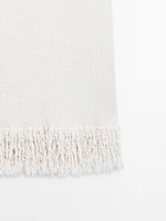 Knit dress with fringed hem