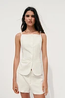 TOP GILET À BOUTONS