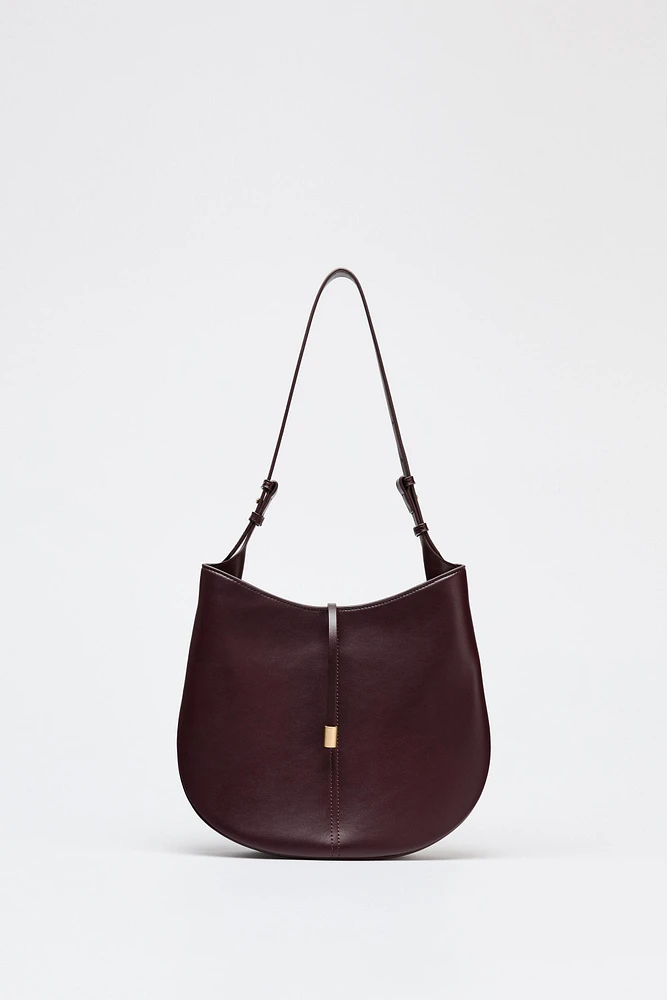 BUCKET BAG WITH PENDANT DETAIL