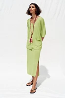TOP OVERSIZE EN MAILLE MANCHES COURTES