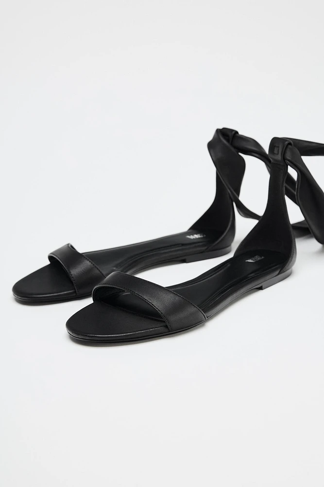 FLAT LEATHER STRAPPY SANDALS