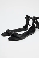 FLAT LEATHER STRAPPY SANDALS