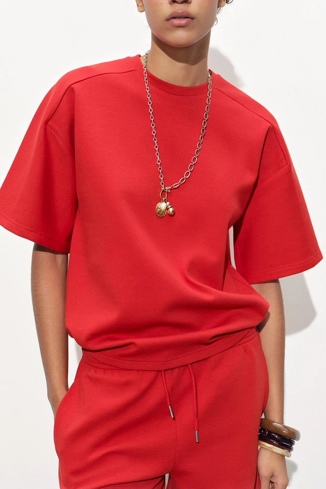 SHORT SLEEVE INTERLOCK SWEATSHIRT
