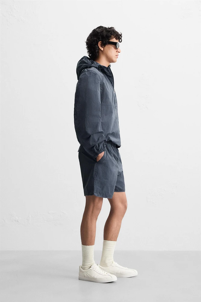 HOODED TECHNICAL JACKET