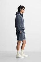 HOODED TECHNICAL JACKET