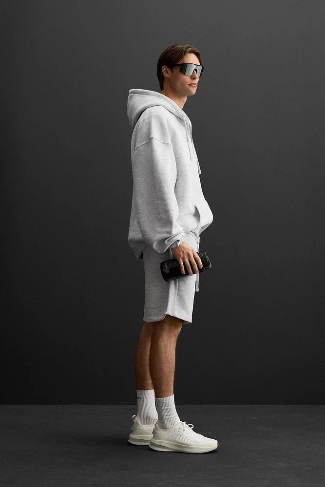SWEAT À CAPUCHE ET ZIP