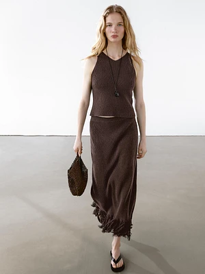 Long knit skirt with fringed hem