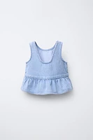 TOP EN DENIM À VOLANTS