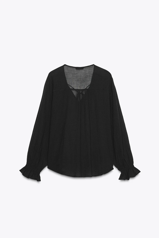 BLOUSE SEMI-TRANSPARENTE