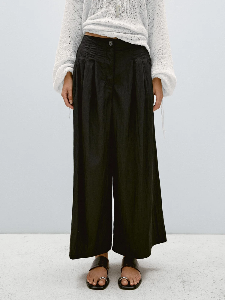 Pantalon palazzo fluide à pinces