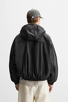 HOODED TECHNICAL JACKET