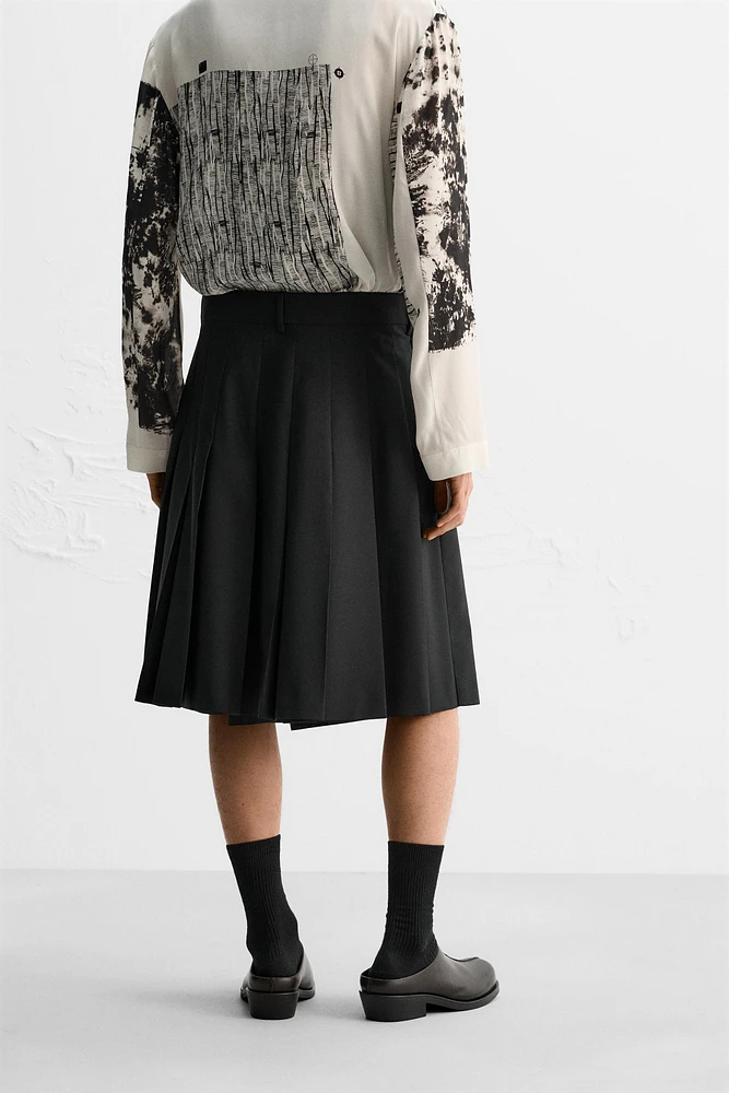 PLEATED WRAP SKIRT LIMITED EDITION