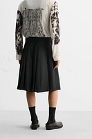 PLEATED WRAP SKIRT LIMITED EDITION