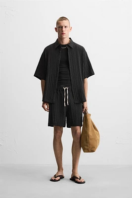 WRINKLED EFFECT JACQUARD BERMUDA SHORTS