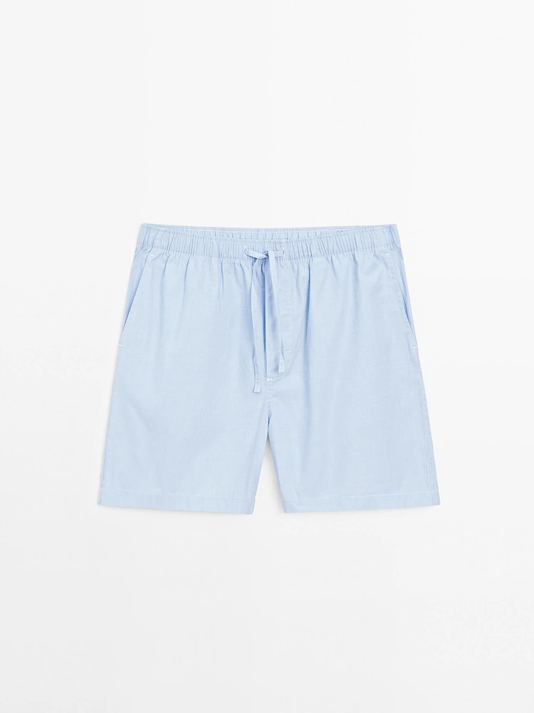 Short sleeve pyjama top and striped trousers