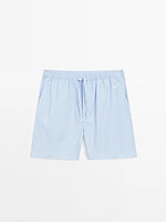 Short sleeve pyjama top and striped trousers