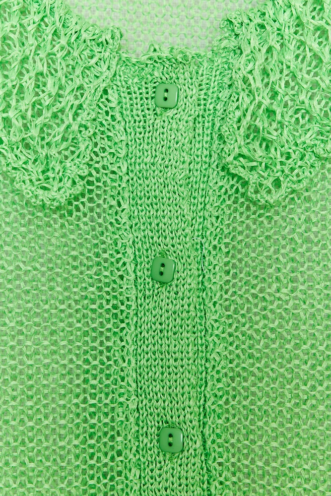 GILET EN MAILLE OUVERT MANCHES COURTES
