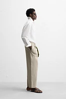 PLEATED CHINO PANTS