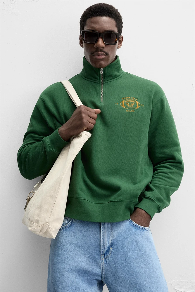 EMBROIDERED QUARTER-ZIP SWEATSHIRT