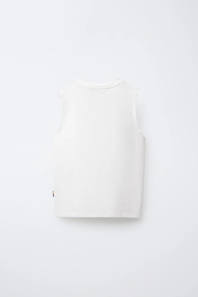 T-SHIRT UNI SANS MANCHES ÉTIQUETTE