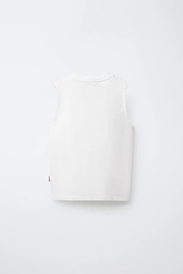 T-SHIRT UNI SANS MANCHES ÉTIQUETTE