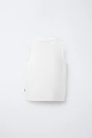 T-SHIRT UNI SANS MANCHES ÉTIQUETTE