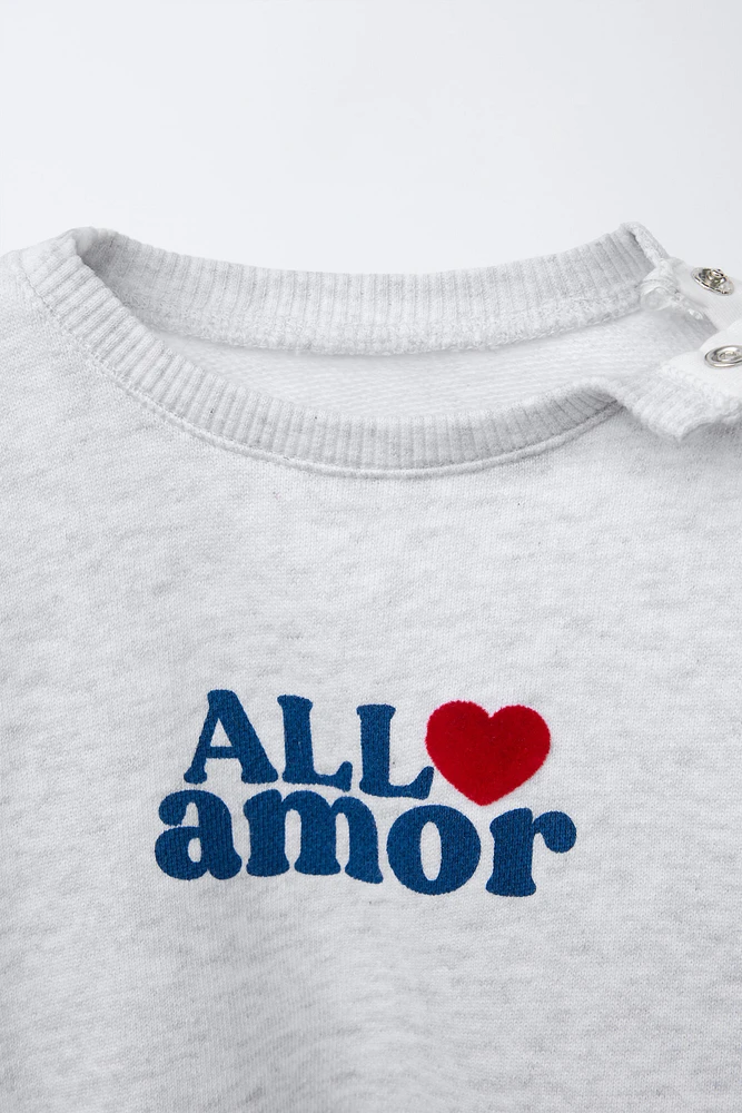 "ALL AMOR" FLOCKED TEXT SWEATSHIRT