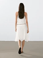 Pleated skirt with godet detail