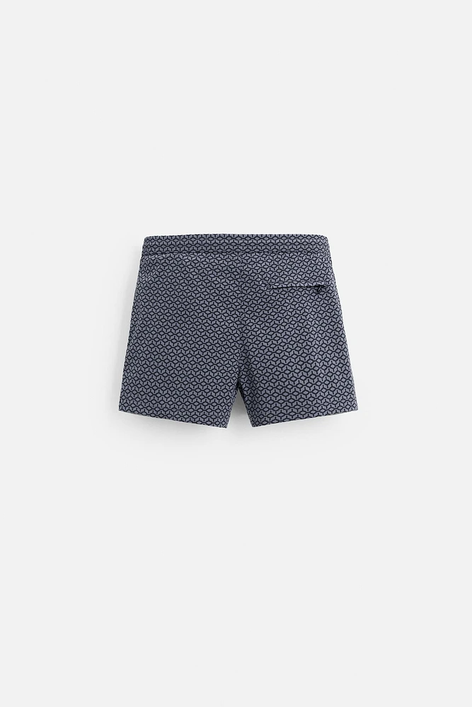 GEOMETRIC PRINT SHORT SWIMMING TRUNKS