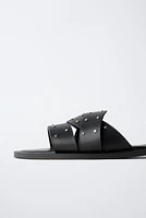 STUDDED FLAT CROSS STRAP SANDALS