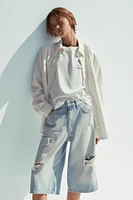 MID-RISE RIPPED DENIM BERMUDA JORTS