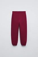 FLOCKED TEXT JOGGING PANTS