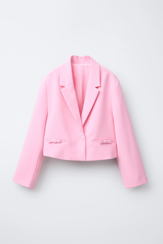 VESTE COURTE À NŒUDS