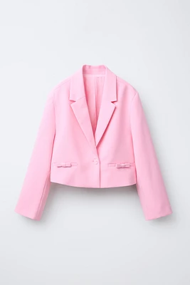 VESTE COURTE À NŒUDS