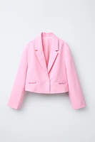 VESTE COURTE À NŒUDS