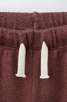 BERMUDA SERVIETTE BANDES LATÉRALES