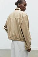 BLOUSON EN MATIÈRE SYNTHÉTIQUE