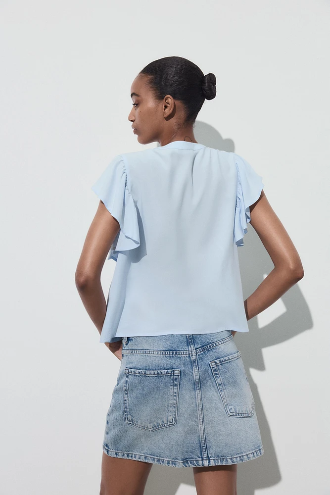 CHEMISE MANCHES COURTES VOLANT