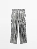 Flowing metallic trousers with gathered detail