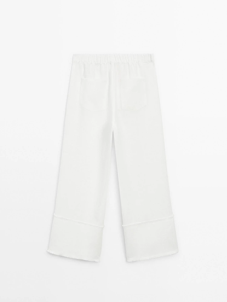 Wide-leg trousers with frayed detailing