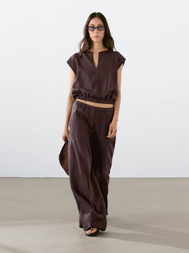 Linen blouse with elasticated hem