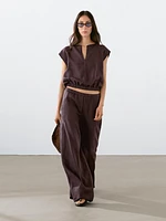 Linen blouse with elasticated hem