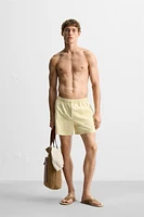 MAILLOT DE BAIN MI-LONG À IMPRIMÉ GÉOMÉTRIQUE