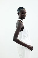TOP HALTER VOLANTS AVEC RAMIE