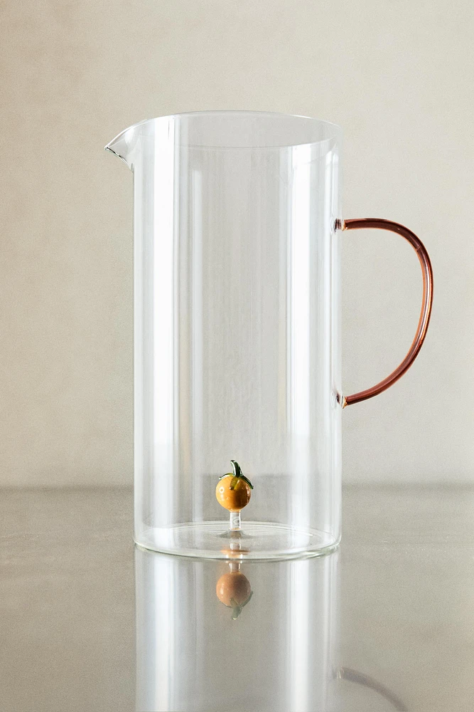 GLASS PITCHER WITH A HANDLE AND ORANGE DETAIL