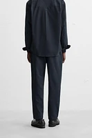 TEXTURED PLEATED PANTS