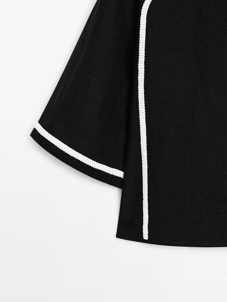 Blouse with contrast embroidery