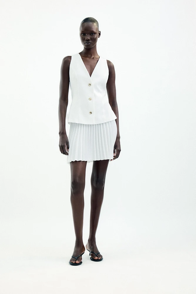 ROBE COURTE EN MATIÈRES VARIÉES